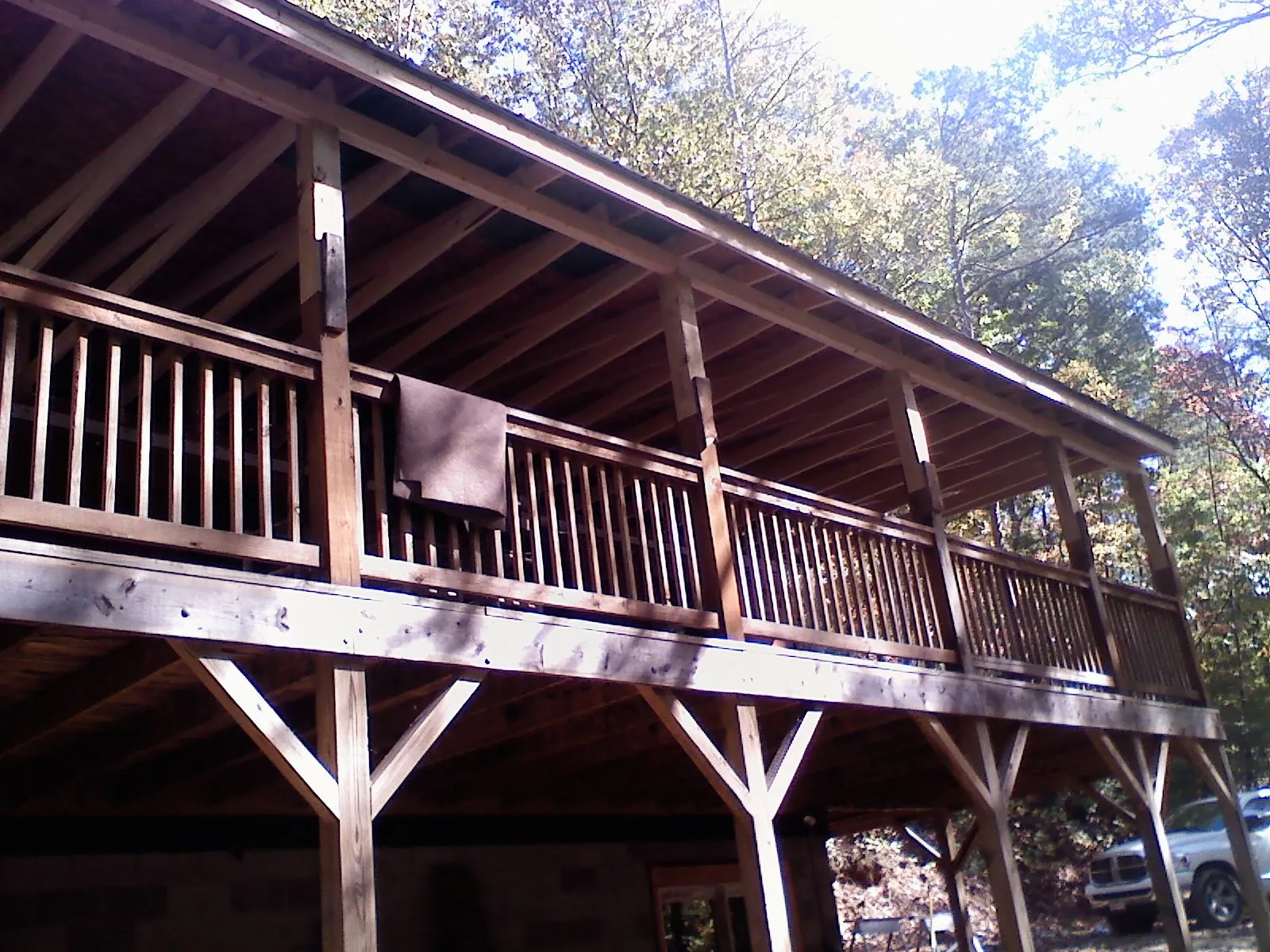 Timber framing under a new elevated porch and deck — Roof Leak Repair in Sweet by Roofing Brothers